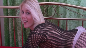 Blonde Sweet Cat wearing fishnets stripteasing