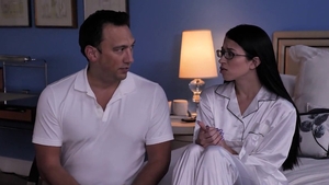 Alex Coal wearing glasses reverse cowgirl